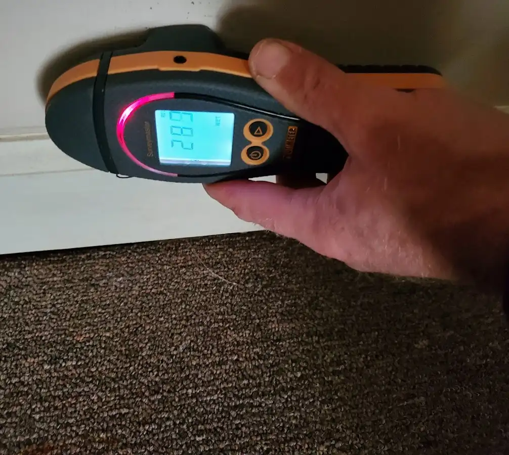 Moisture detection at baseboard during Storm Damage Restoration in Tullahoma